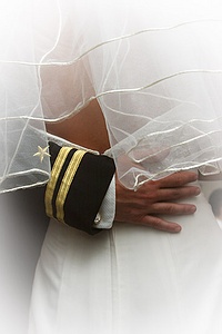 Groom's hand around bride's waist