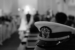 A navy hat at a wedding